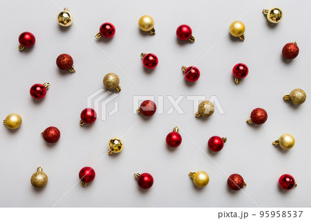 Christmas composition. a pattern of christmas balls on colored background. Flat lay, top view New year decor Christmas composition. a pattern of christmas balls on colored background. Flat lay, top view New year decor 95958537
