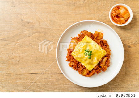 kimchi fried rice with pork and topped cheese 95960951