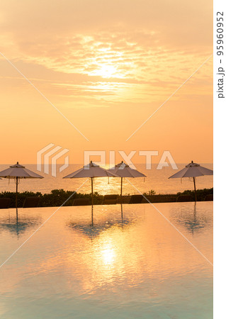 umbrella with bed pool around swimming pool with ocean sea background 95960952