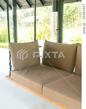 empty sofa swing in garden 95961047