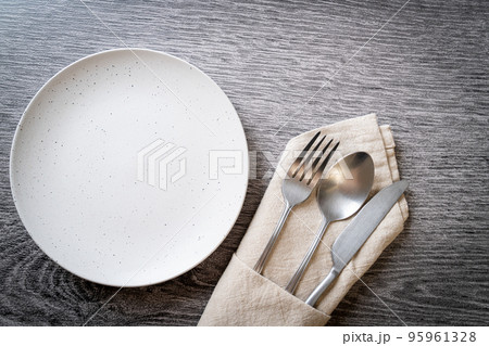 empty plate or dish with knife, fork and spoon 95961328