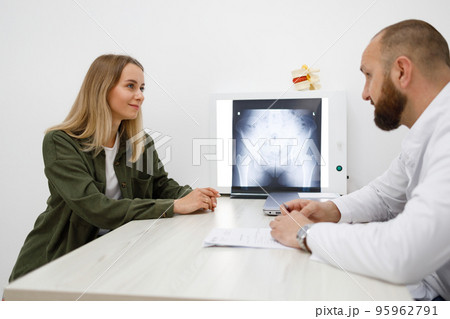 Young woman visiting orthopedist in medical office 95962791