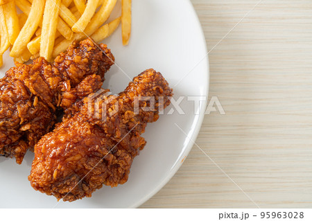 spicy Korean fried chicken with fries spicy Korean fried chicken with fries 95963028