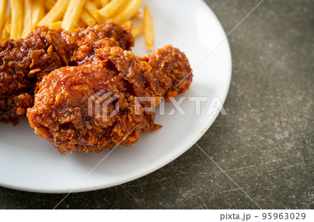 spicy Korean fried chicken with fries 95963029
