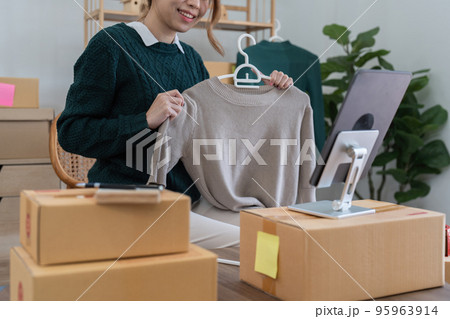 Startup small business entrepreneur of freelance Asian woman using a laptop with box Cheerful success online marketing packaging box and delivery SME idea concept Startup small business entrepreneur of freelance Asian woman using a laptop with box Cheerful success online marketing packaging box and delivery SME idea concept 95963914