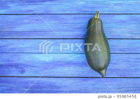 Zucchini on wooden boards outdoors Zucchini on wooden boards outdoors 95965458