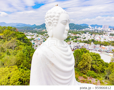 A white Buddha on a lotus flower. A white Buddha on a lotus flower. 95966812