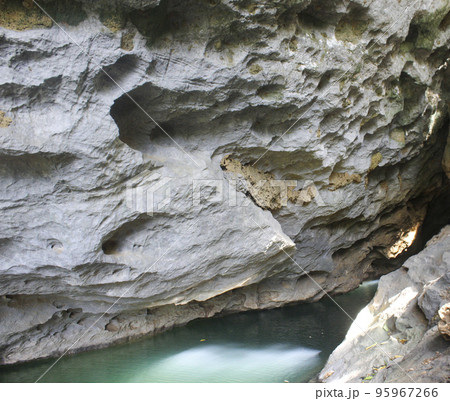 Beautiful Stone Cavern Green River in Pucok Krueng Beautiful Stone Cavern Green River in Pucok Krueng 95967266