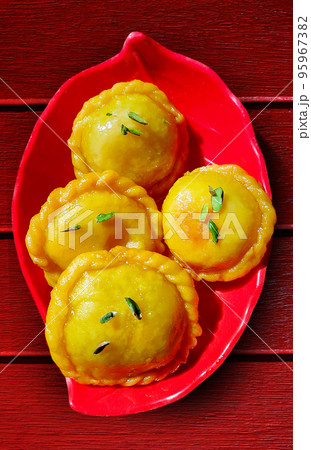 Indian Diwali Sweet Food Chandrakala Gujia is Made with Maida for Outer Covering And Khoya, Nuts Indian Diwali Sweet Food Chandrakala Gujia is Made with Maida for Outer Covering And Khoya, Nuts 95967382