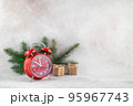 New Year clock with fir branch holiday card on light winter background 95967743