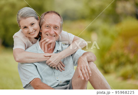 Love, smile and portrait of old couple in nature on vacation, holiday or summer trip. Relax, hug and happy senior, retired man and woman outdoors enjoying quality time together and bonding at park. 95968225