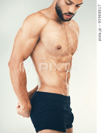 Bodybuilder, muscular man and health for flexing, fitness and workout for wellness with studio background. Young male, confident athlete and power for endurance, exercise and stamina for body care. Bodybuilder, muscular man and health for flexing, fitness and workout for wellness with studio background. Young male, confident athlete and power for endurance, exercise and stamina for body care. 95968617