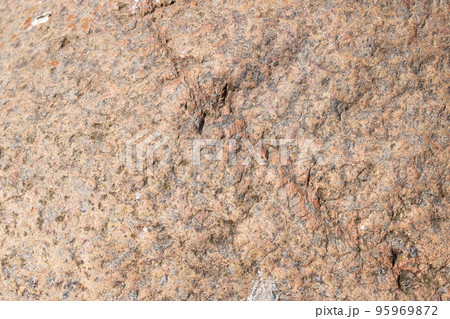 Grey uneven stone closeup background or texture Grey uneven stone closeup background or texture 95969872