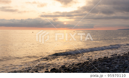 Amazing beach sunset over Black Sea. Lazarevskoye, Sochi, Russia 95970110