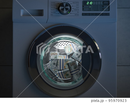 Dirty money laundering concept. Dollar packs laundering in washing machine under clioud of night. 95970923