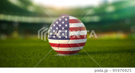 Football ball with flag of USA on the field of football stadium and space for name of football clubs. Football championship of United States concept. 95970925
