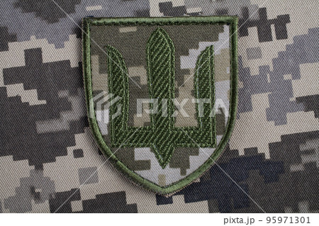 KYIV, UKRAINE - October 5, 2022. Russian invasion in Ukraine 2022. Ukraine Army uniform shoulder sleeve insignia badge. 95971301
