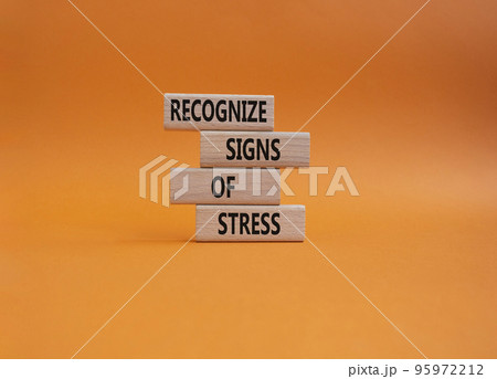 Recognize Signs of Stress symbol. Concept words Recognize Signs of Stress on wooden blocks. Beautiful orange background. Medicine and Business and Recognize Signs of Stress concept. Copy space Recognize Signs of Stress symbol. Concept words Recognize Signs of Stress on wooden blocks. Beautiful orange background. Medicine and Business and Recognize Signs of Stress concept. Copy space 95972212