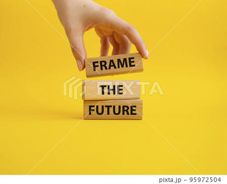 Frame the future symbol. Wooden blocks with words Frame the future. Beautiful yellow background. Businessman hand. Business and Frame the future concept. Copy space. Frame the future symbol. Wooden blocks with words Frame the future. Beautiful yellow background. Businessman hand. Business and Frame the future concept. Copy space. 95972504