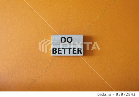 Do better symbol. Wooden blocks with words Do better. Beautiful orange background. Business and Do better concept. Copy space. Do better symbol. Wooden blocks with words Do better. Beautiful orange background. Business and Do better concept. Copy space. 95972943