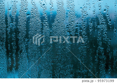 Texture of misted glass in autumn. Drops of water on window 95973199