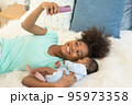 Young mother and newborn baby making video call and smiling greet 95973358