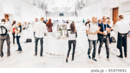 Abstract blurred people socializing during buffet lunch break at business meeting or conference. 95974691