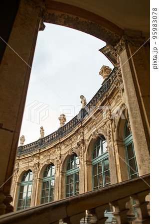 Saxon architecture in Dresden. Saxon Palace Zwinger. Facade of the building decorated with columns 95983078