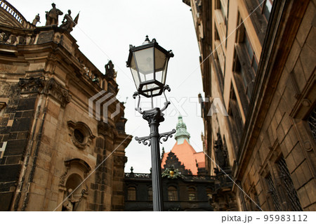 An old Baroque street lamp illuminating the palace grounds An old Baroque street lamp illuminating the palace grounds 95983112