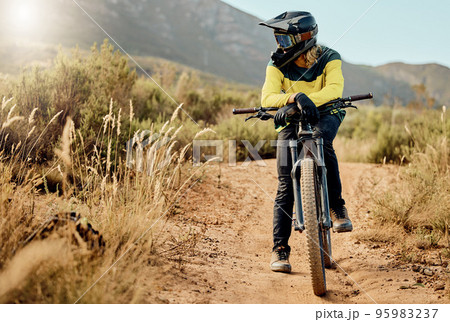 Mountain bike, sports and nature man in fitness adventure, travel and journey in Australia dirt path for marathon, race or training. Cycling man on bicycle with safety helmet gear for outdoor sport 95983237