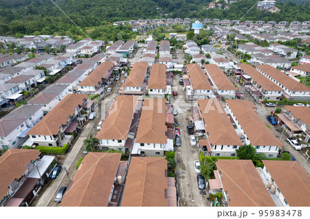 New development real estate. Aerial view of residential houses and driveways neighborhood during a fall sunset or sunrise time.Tightly packed homes.Top down view over private houses in phuket thailand 95983478
