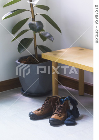 leather shoe and used socks put at foyer at the home. 95985520