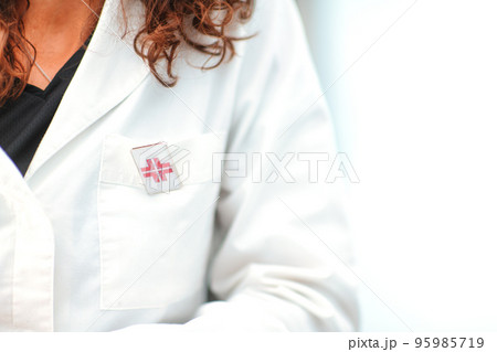 Woman doctor detail dil white coat Woman doctor detail dil white coat 95985719