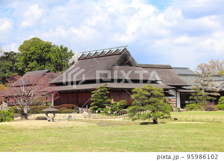 Ancient pavilion and stone lantern in Koishikawa Korakuen garden, Okayama, Japan Ancient pavilion and stone lantern in Koishikawa Korakuen garden, Okayama, Japan 95986102