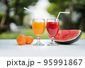 Orange juice and Watermelon juice on the natural background 95991867