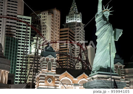 Las Vegas, USA. September 16, 2022. Illuminated Replica of Statue of Liberty and rollercoaster in New York, New York hotel and casino. Modern buildings in famous Las Vegas city during night. Las Vegas, USA. September 16, 2022. Illuminated Replica of Statue of Liberty and rollercoaster in New York, New York hotel and casino. Modern buildings in famous Las Vegas city during night. 95994105