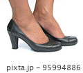 Female feet in black secretary shoes on white background 95994886
