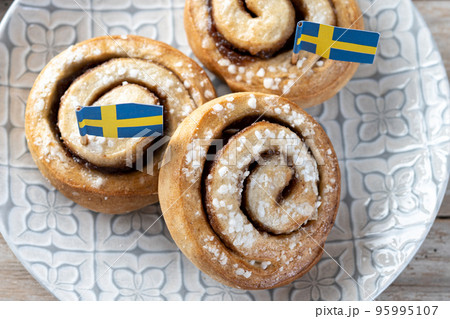 Cinnamon rolls buns on wooden table with copy space. Kanelbulle Swedish dessert 95995107