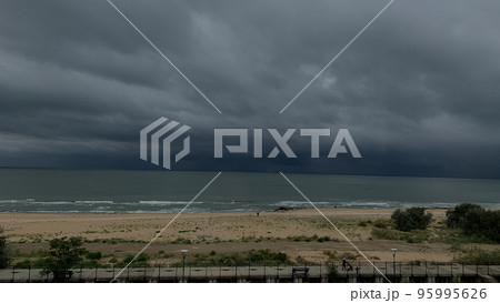 grey overcast sky over sea waves 95995626