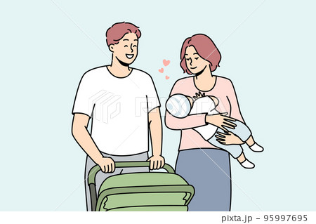 Happy parents with infant walking outside  95997695