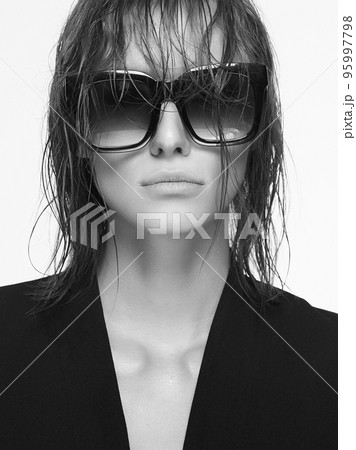 portrait of young woman with Wet Hair and trendy Glasses portrait of young woman with Wet Hair and trendy Glasses 95997798