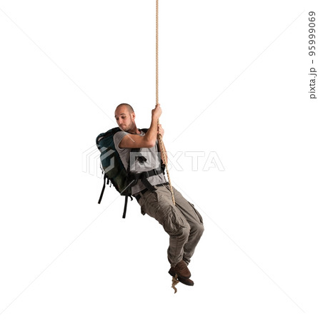 Explorer hanging from a rope 95999069