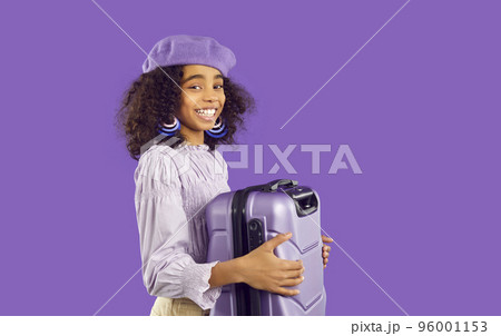 Happy African American girl with suitcase ready for trip 96001153