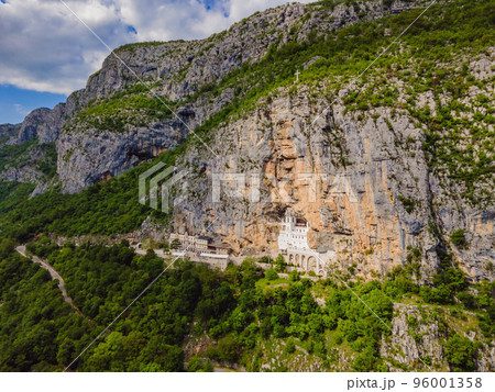 Monastery of Ostrog, Serbian Orthodox Church situated against a vertical background, high up in the large rock of Ostroska Greda, Montenegro. Dedicated to Saint Basil of Ostrog Monastery of Ostrog, Serbian Orthodox Church situated against a vertical background, high up in the large rock of Ostroska Greda, Montenegro. Dedicated to Saint Basil of Ostrog 96001358