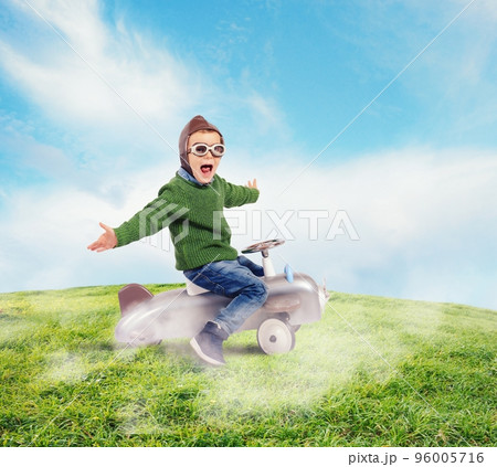 Cheerful boy kid playing at the aviator 96005716