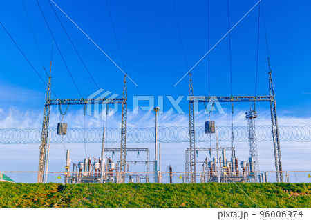 Industrial landscape with beautiful blue sky with clouds and power substation Industrial landscape with beautiful blue sky with clouds and power substation 96006974