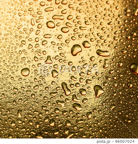 Abstract background with water drops on a gold surface Abstract background with water drops on a gold surface 96007024
