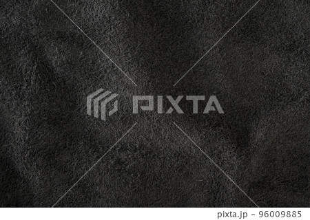 Black suede close-up. Natural black suede texture for design or project. Velvet, leather reverse. Black suede close-up. Natural black suede texture for design or project. Velvet, leather reverse. 96009885