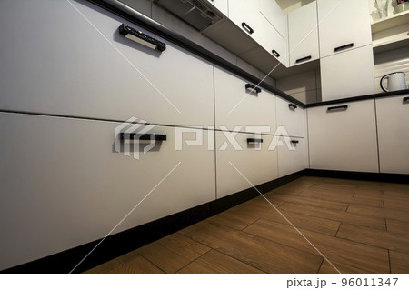 Close-up detail of white modern kitchen drawers 96011347