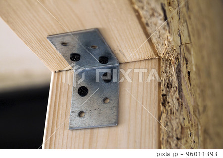 Close up detail of house construction wooden wall elements. Interior frame renovation work 96011393